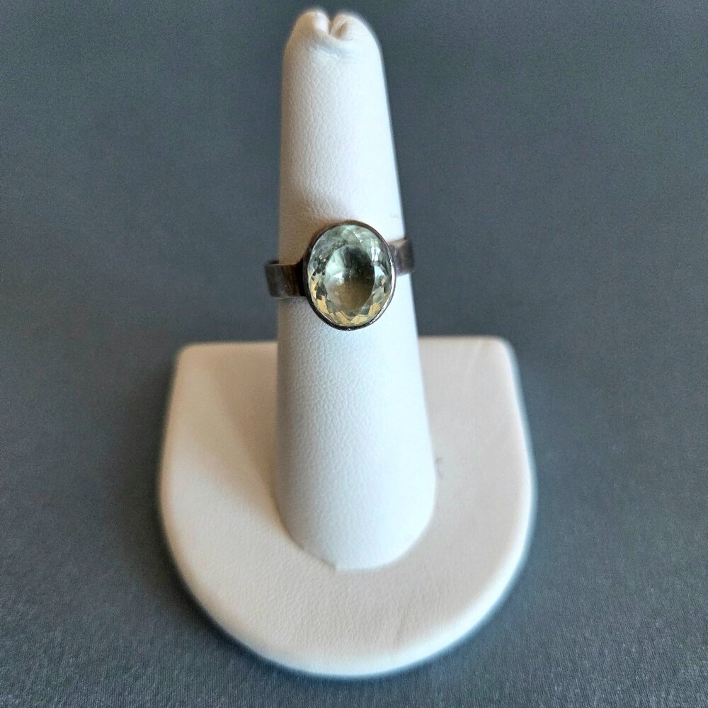 Sterling silver ring with light blue/green stone.